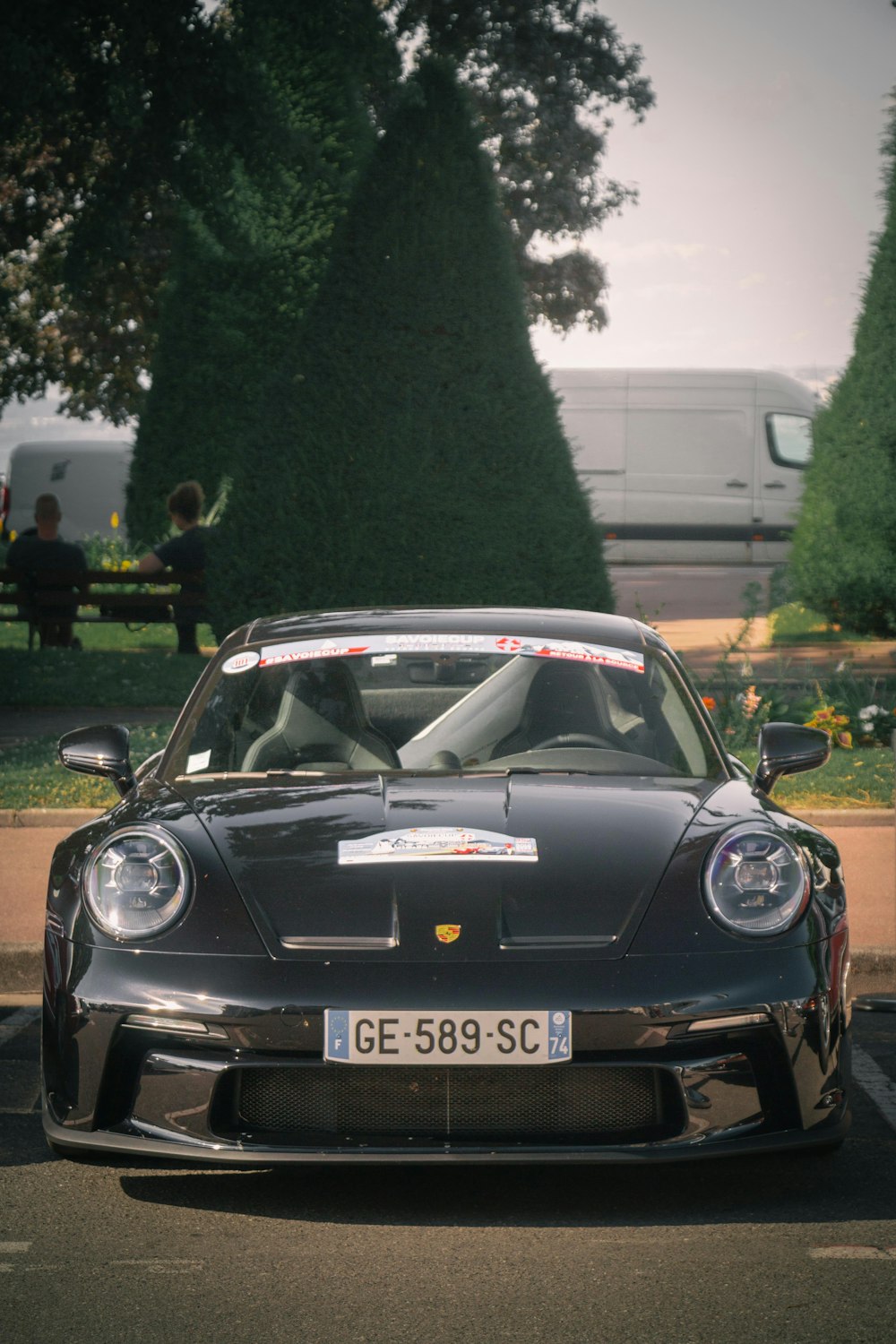 a black sports car parked in a parking lot