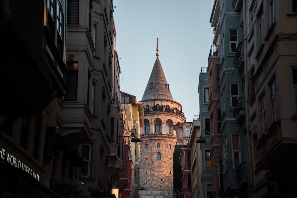 a tall tower towering over a city filled with tall buildings