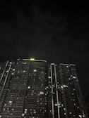 Night view of Sama Real Estate's commercial building illuminated beautifully