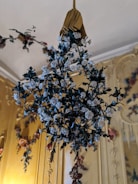 Luxurious floral arrangement with golden crescent moon detail and elegant roses