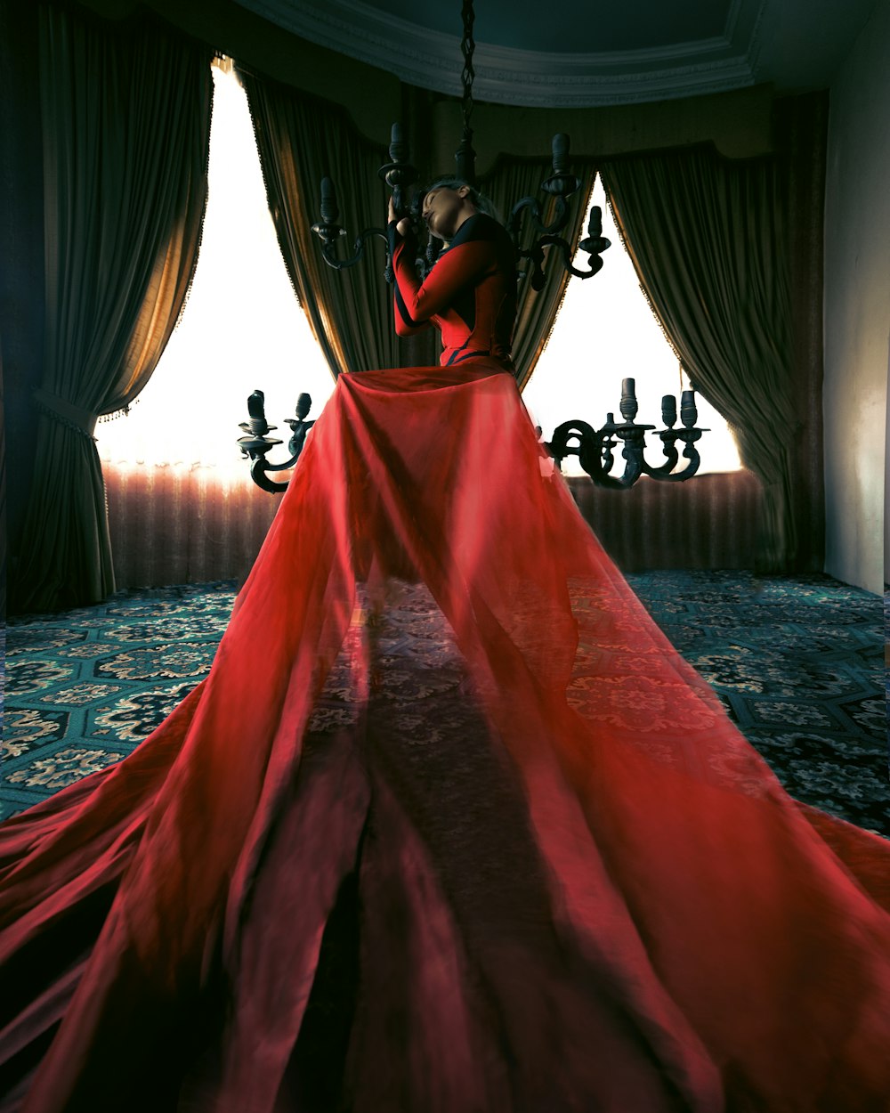 a woman in a red dress sitting on a chair