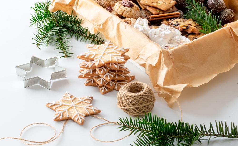 a box filled with cookies next to christmas decorations