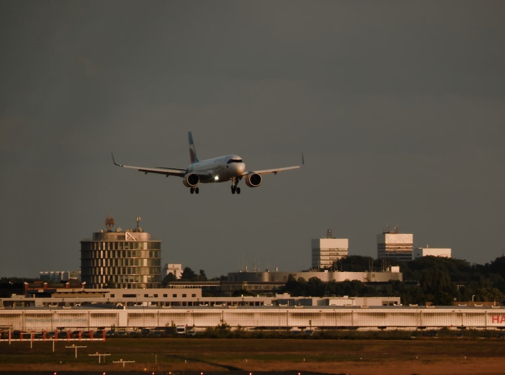 a large jetliner flying through a cloudy sky