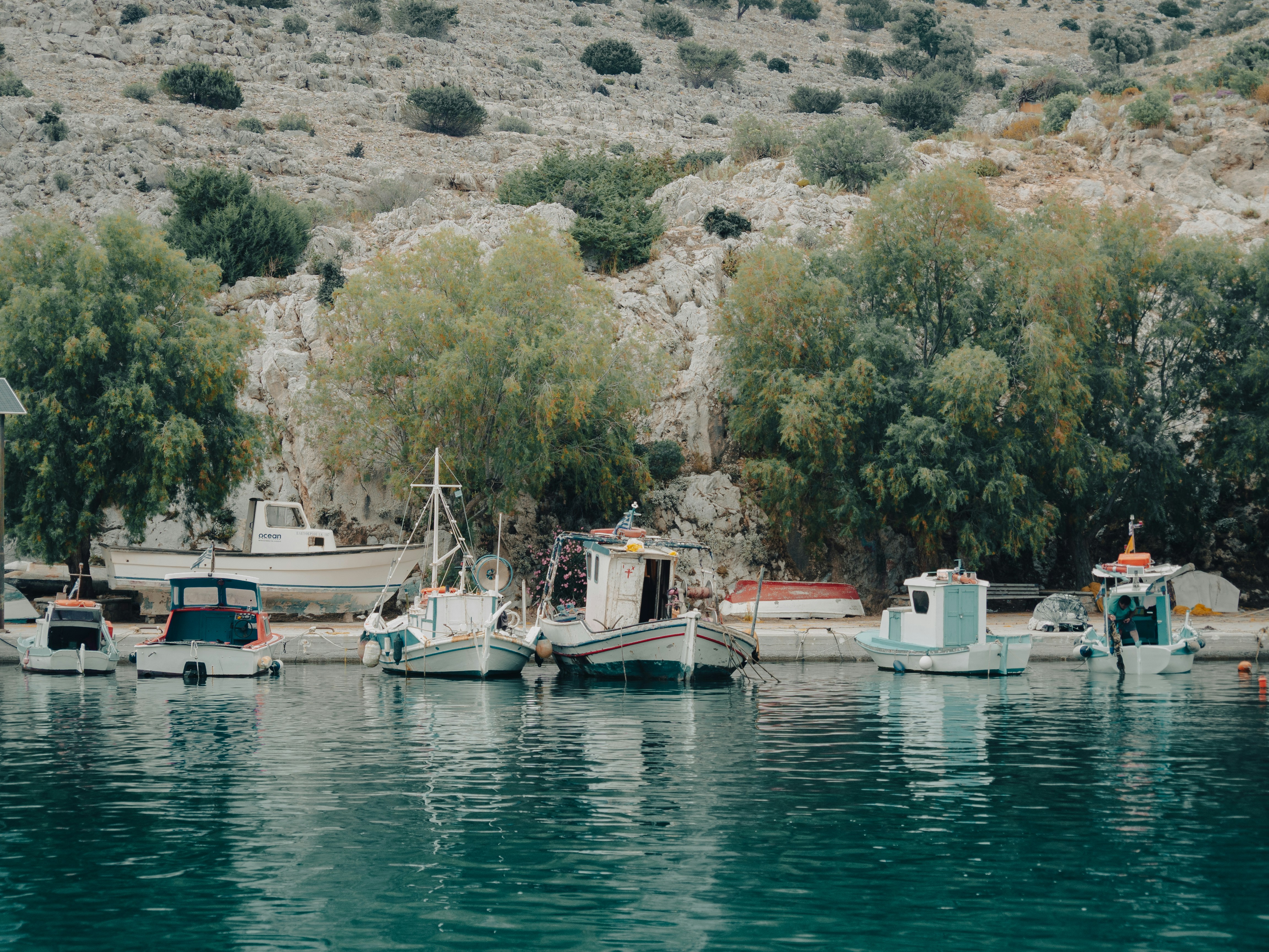 a group of boats sitting on top of a body of water