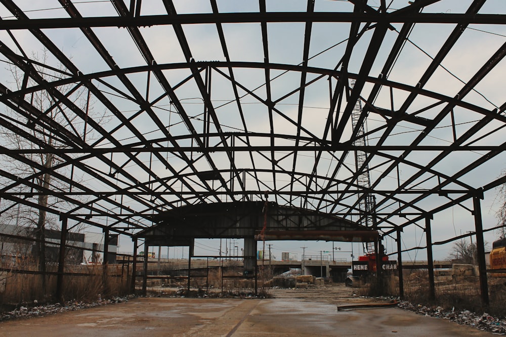 a large metal structure with a sky background