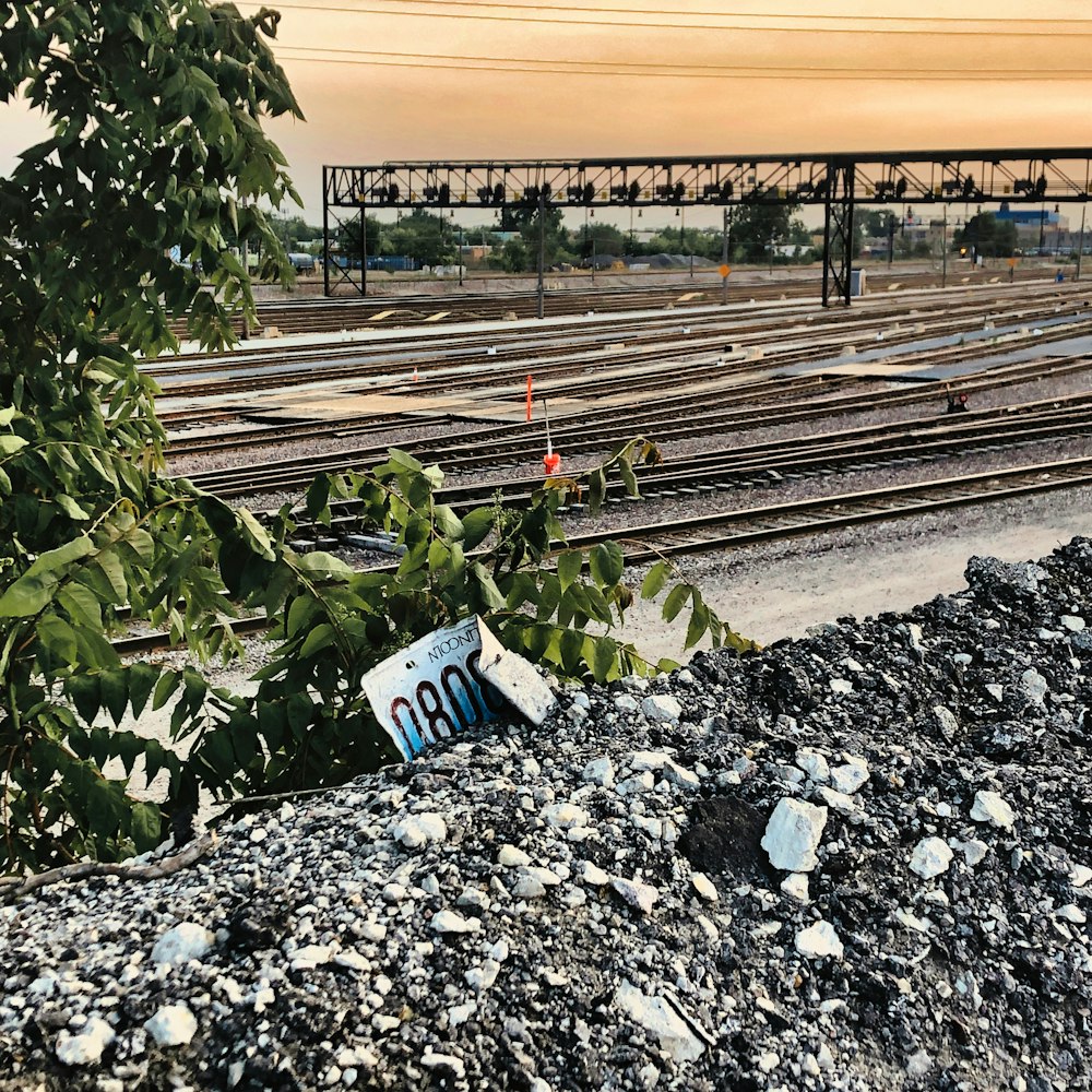 a train track with a sign on it