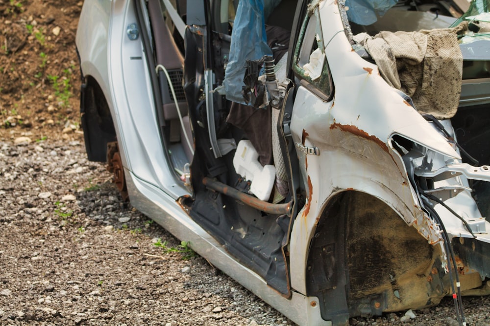 a car that is sitting in the dirt