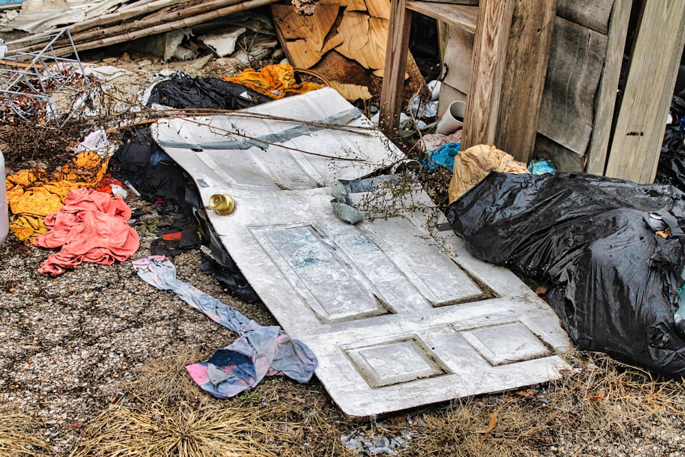 a pile of garbage sitting next to a building