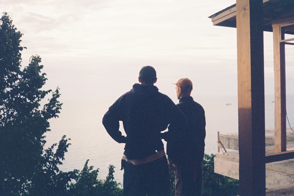 a couple of men standing next to each other