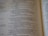 An open book with text printed in two columns. The text appears to be in a poetic format with indented lines and is focused on a religious or spiritual theme. The pages show chapter and verse numbers, indicating scriptural content.