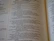 An open book with text printed in two columns. The text appears to be in a poetic format with indented lines and is focused on a religious or spiritual theme. The pages show chapter and verse numbers, indicating scriptural content.