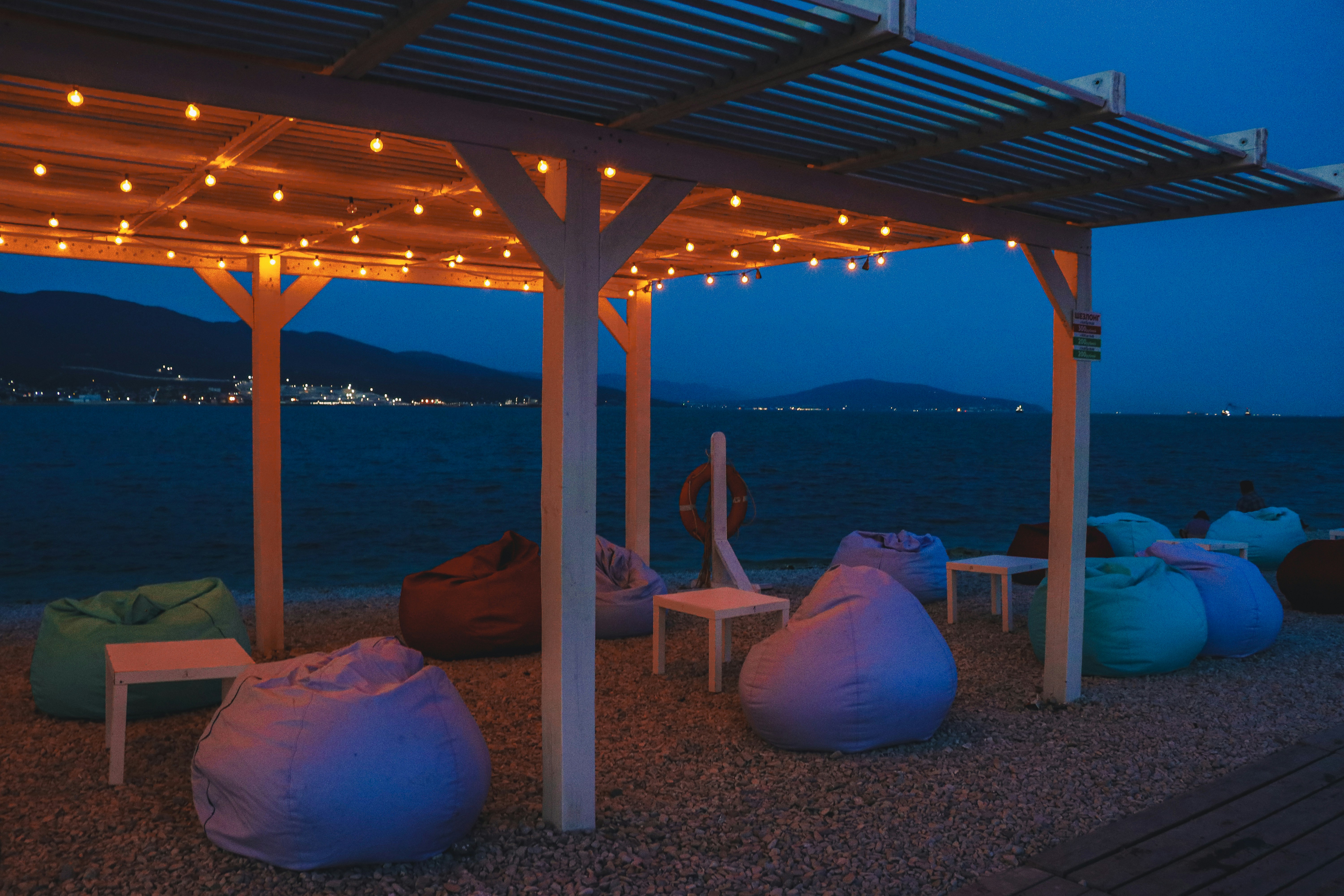 a group of bean bags sitting under a pergol