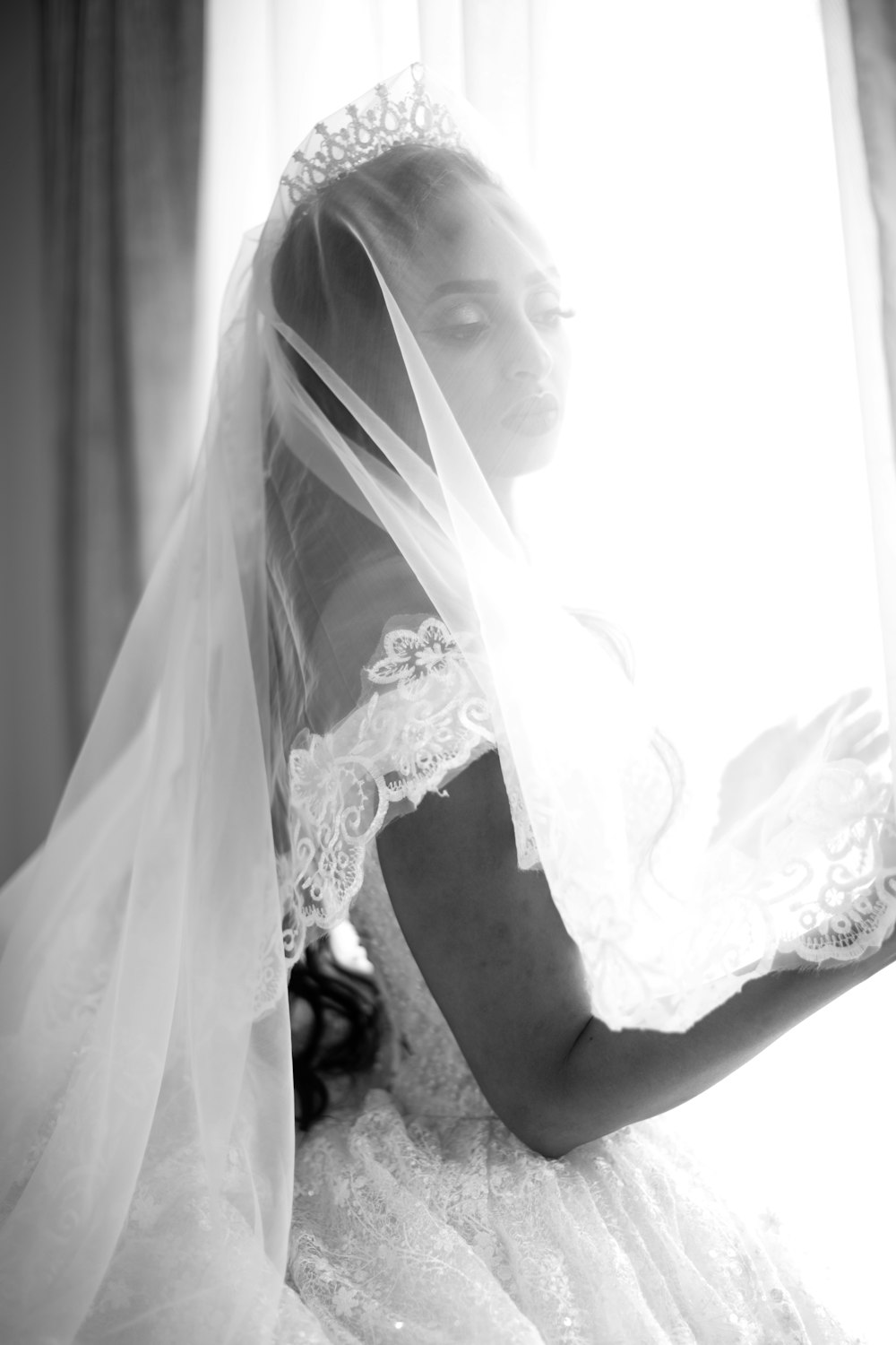 a woman in a wedding dress and veil