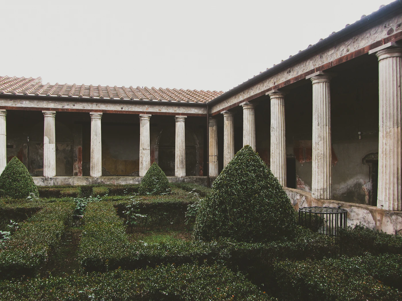 Orderly columns lining an ancient Roman courtyard in Pompeii