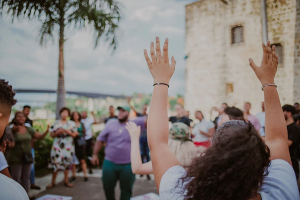 A group of diverse workers gathered outdoors, sharing stories, united by purpose and friendship.