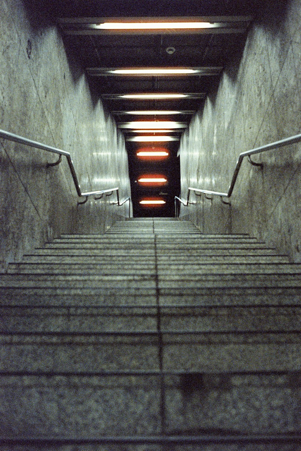 a set of stairs leading up to a tunnel