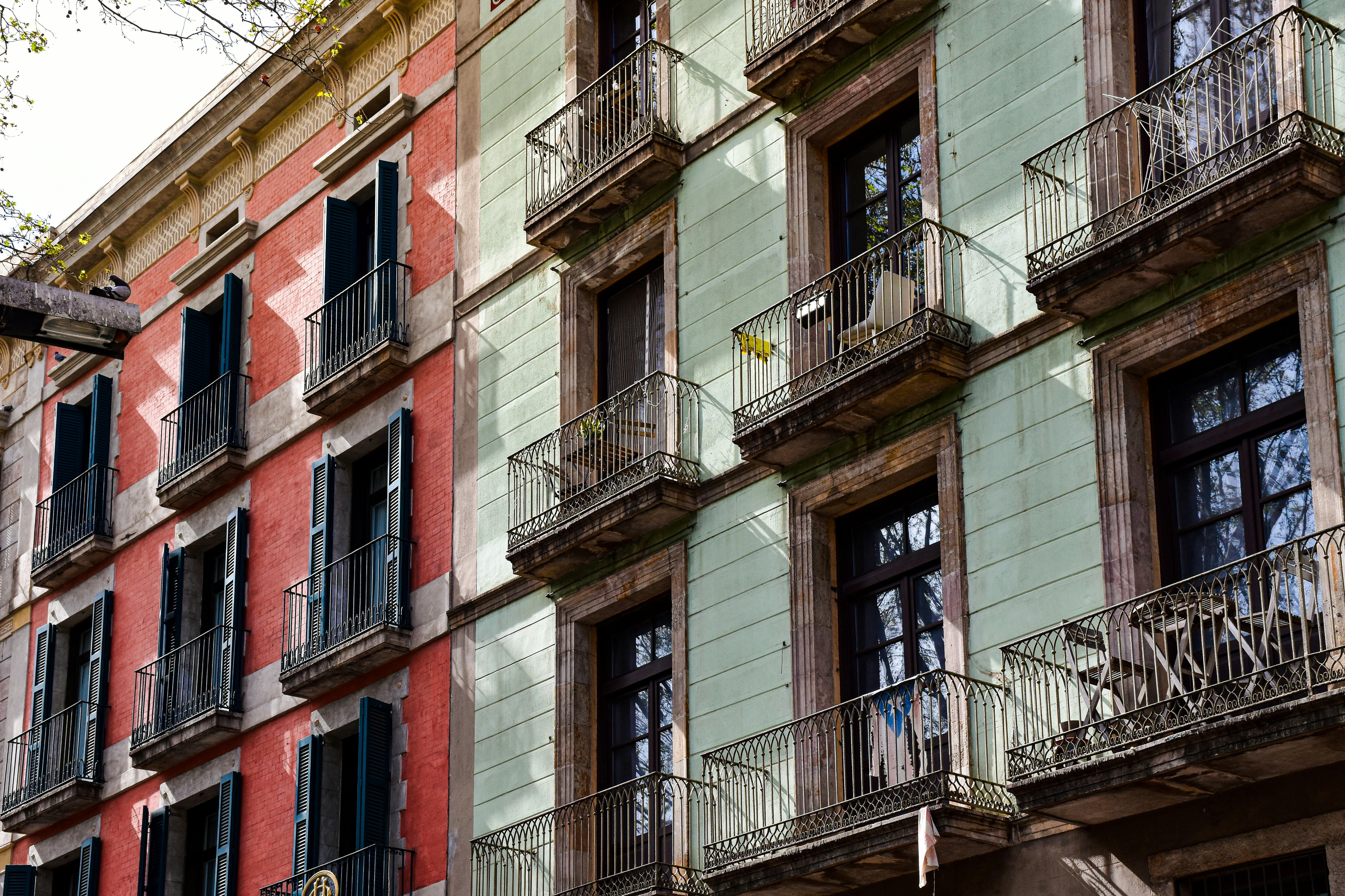 a multi - colored building with balconies and balconies, Barcelona, Spain.