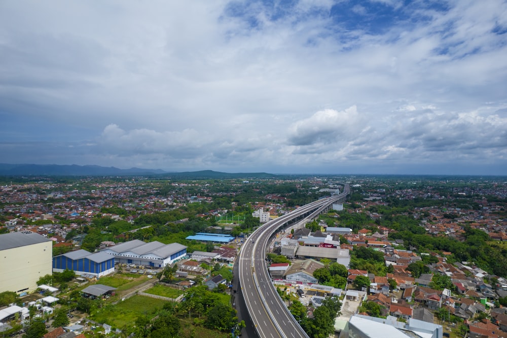 an aerial view of a highway and a city