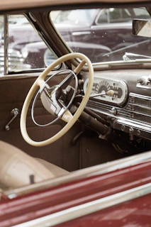 Interior shot showing the classic steering wheel and dashboard of a well-preserved Beetle