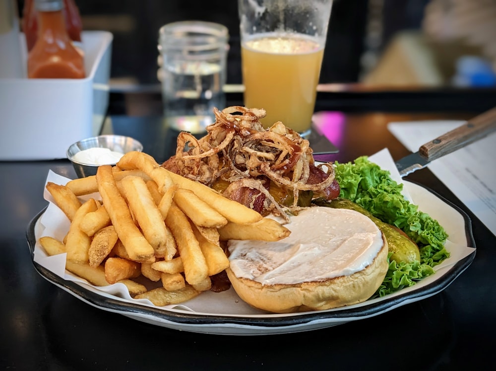 a plate with a sandwich and french fries on it