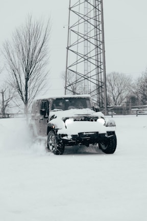 Skoda Super B 4x4 driving through snowy forest landscape on a clear day