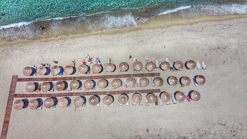 a group of people laying on top of a sandy beach