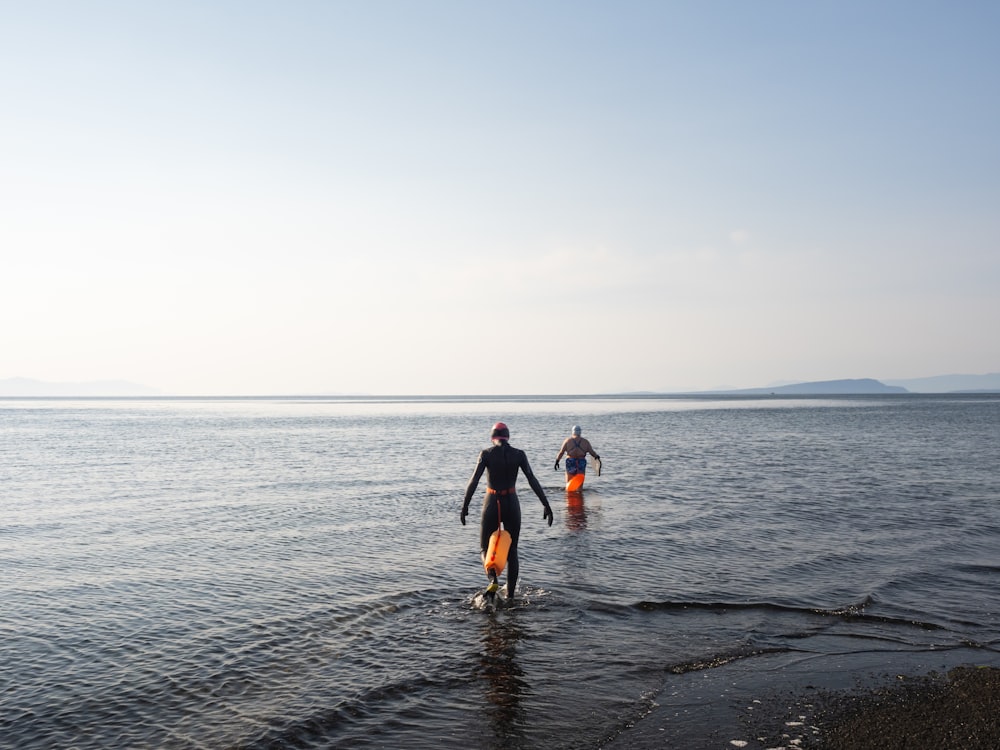 a couple of people that are in the water