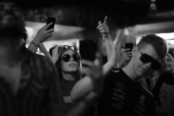 A lively photo booth setup with people enjoying and posing for the camera at an event.