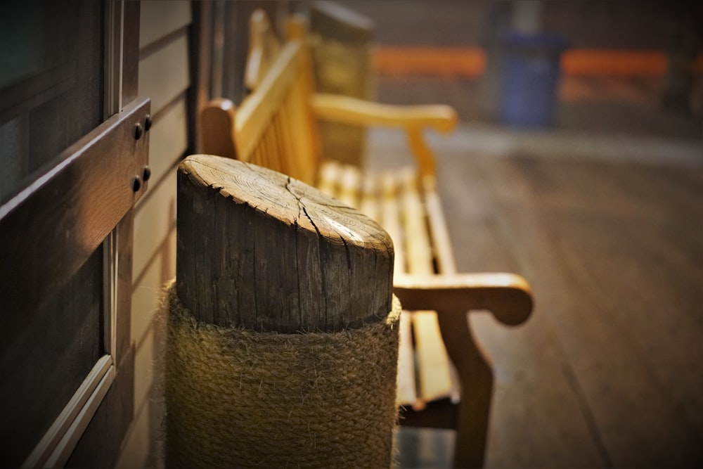 a wooden bench sitting on top of a wooden floor