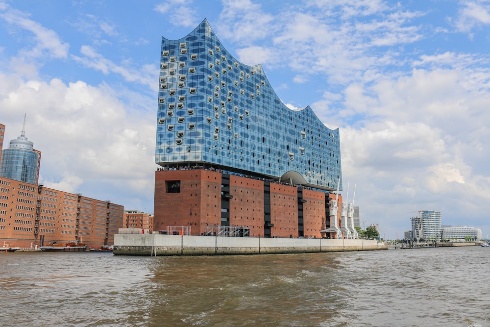 a very tall building next to a body of water