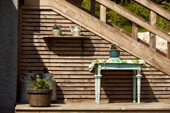 a small table with a potted plant on top of it