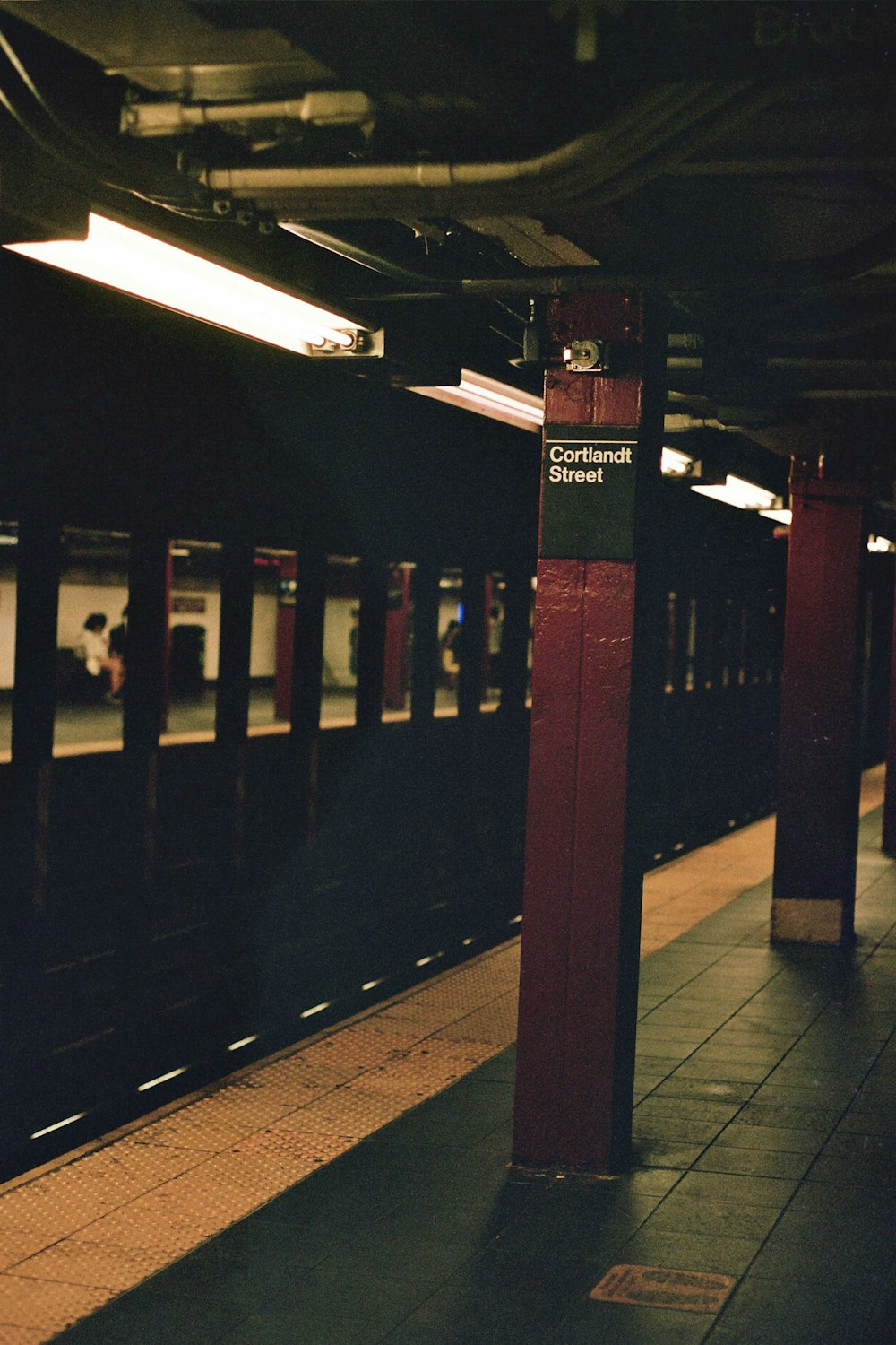 a subway train pulling into a train station