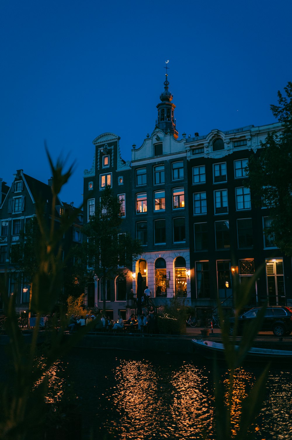 a building with a clock tower lit up at night