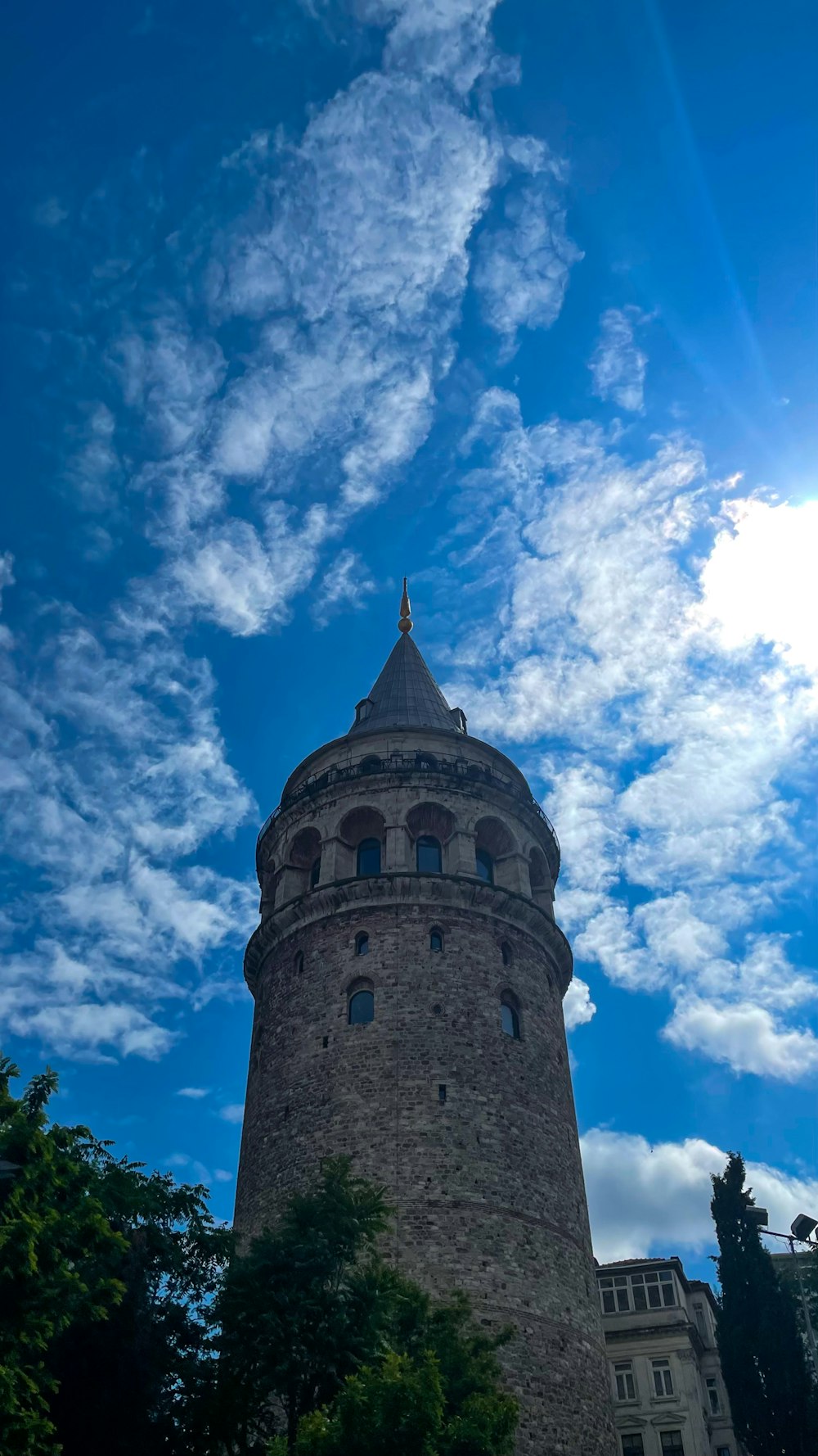 a very tall tower with a sky background