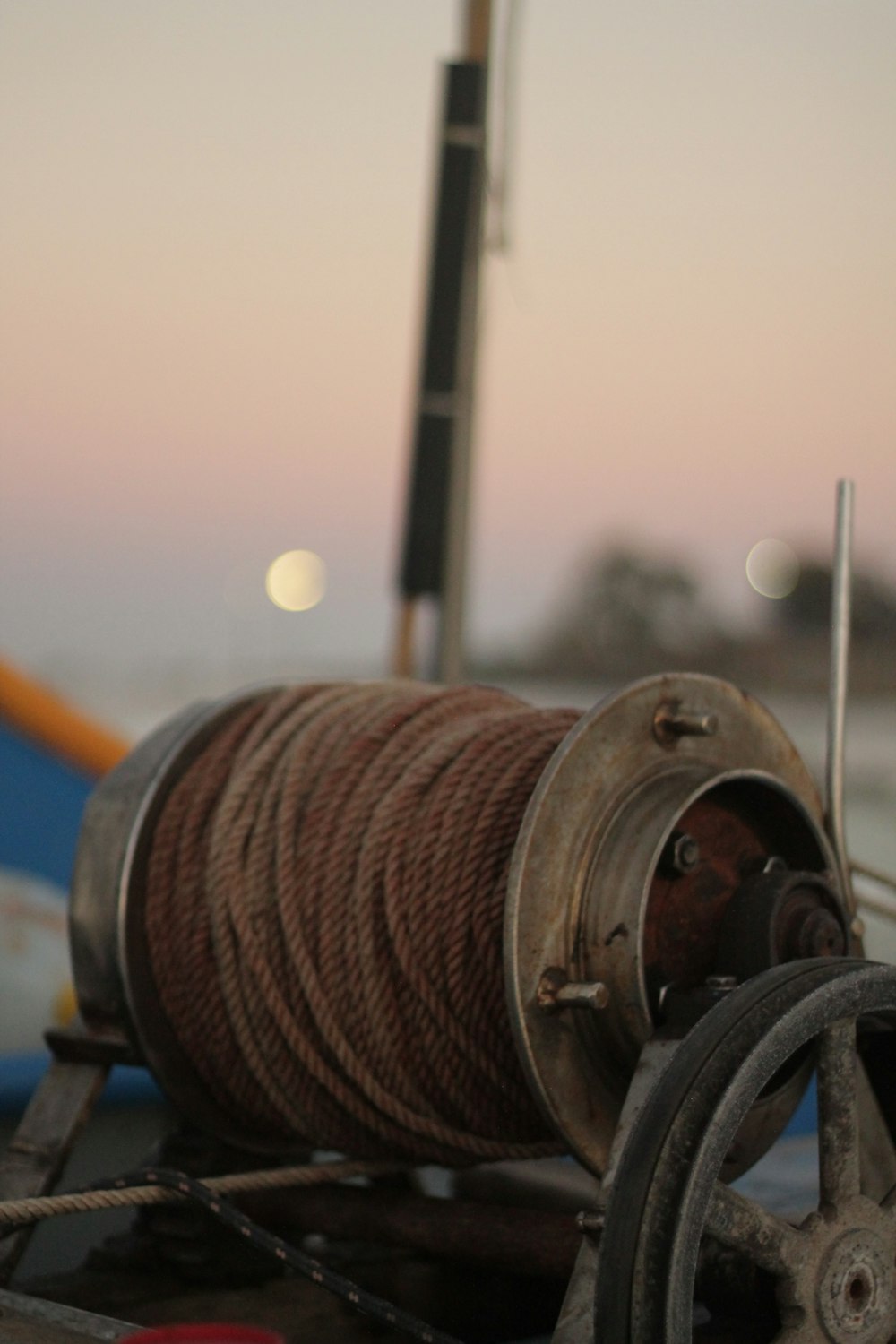 a spool of rope sitting on top of a boat