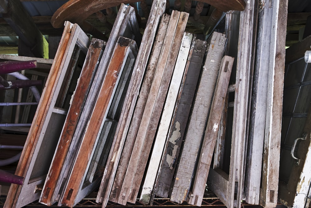 a pile of old wooden boards stacked on top of each other