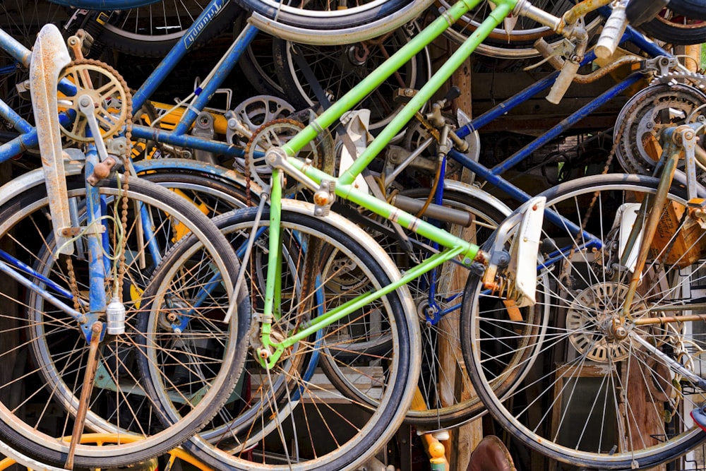 a bunch of bikes that are stacked on top of each other