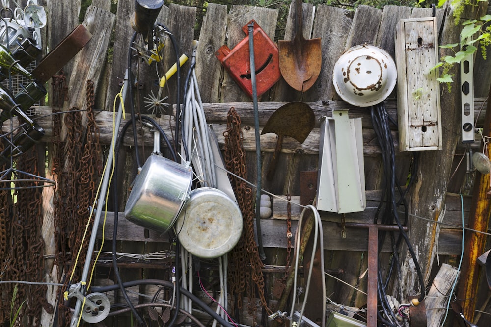 a wooden fence covered in lots of junk
