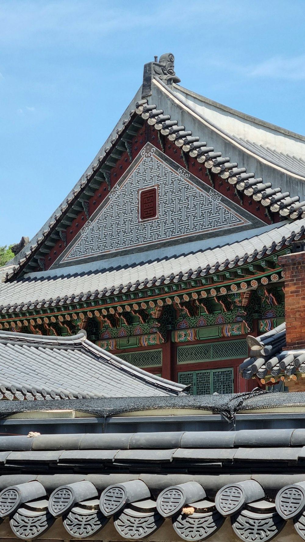 the roof of a building with a clock on it