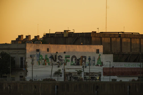 Artistic urban scene featuring a model framed by golden hour light and city architecture.