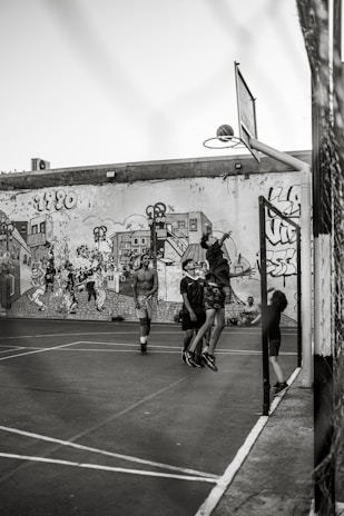 A close-up of young basketball players engaged in a friendly scrimmage, showcasing teamwork.