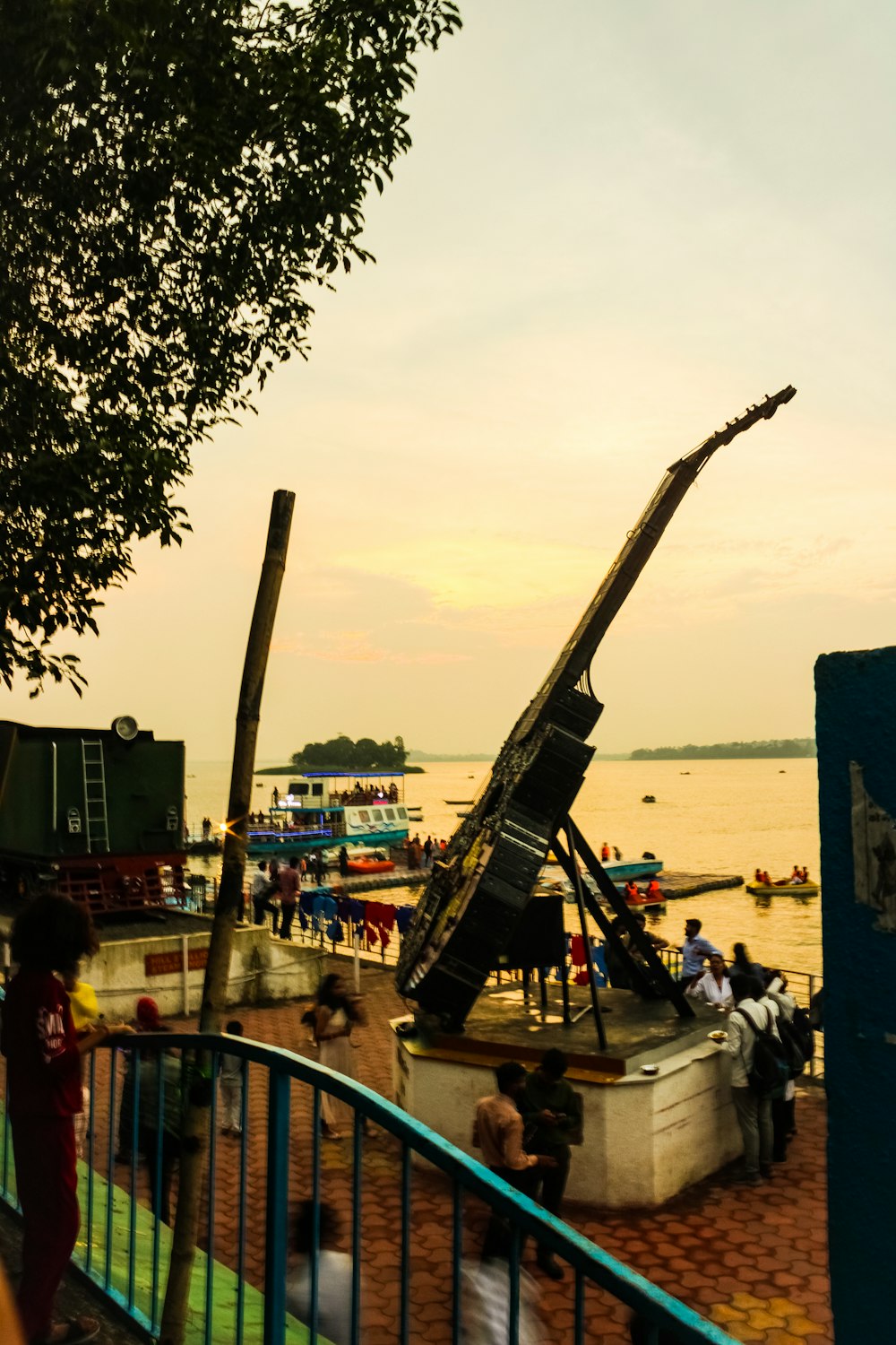 a boat sitting on top of a wooden dock next to a body of water