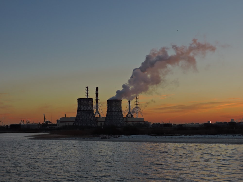 a factory with smoke coming out of it's stacks