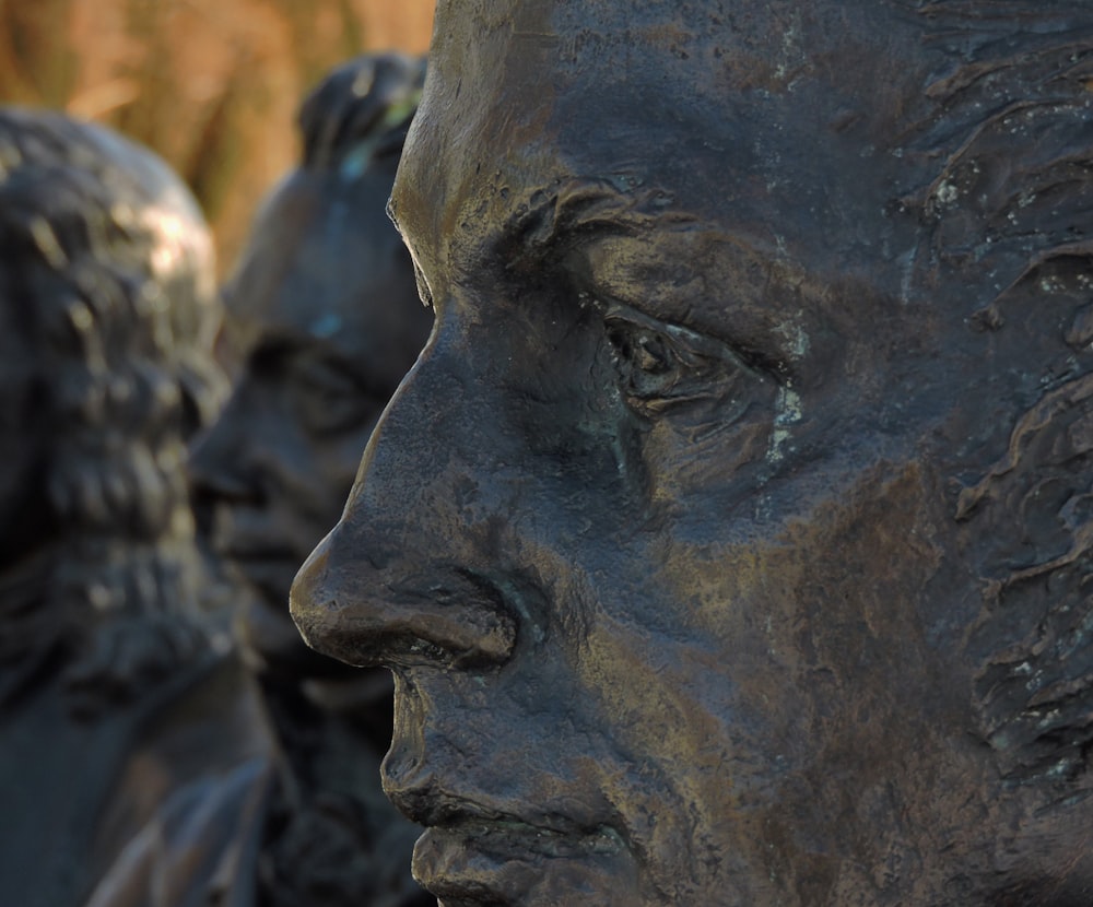 a close up of a statue of a man's face