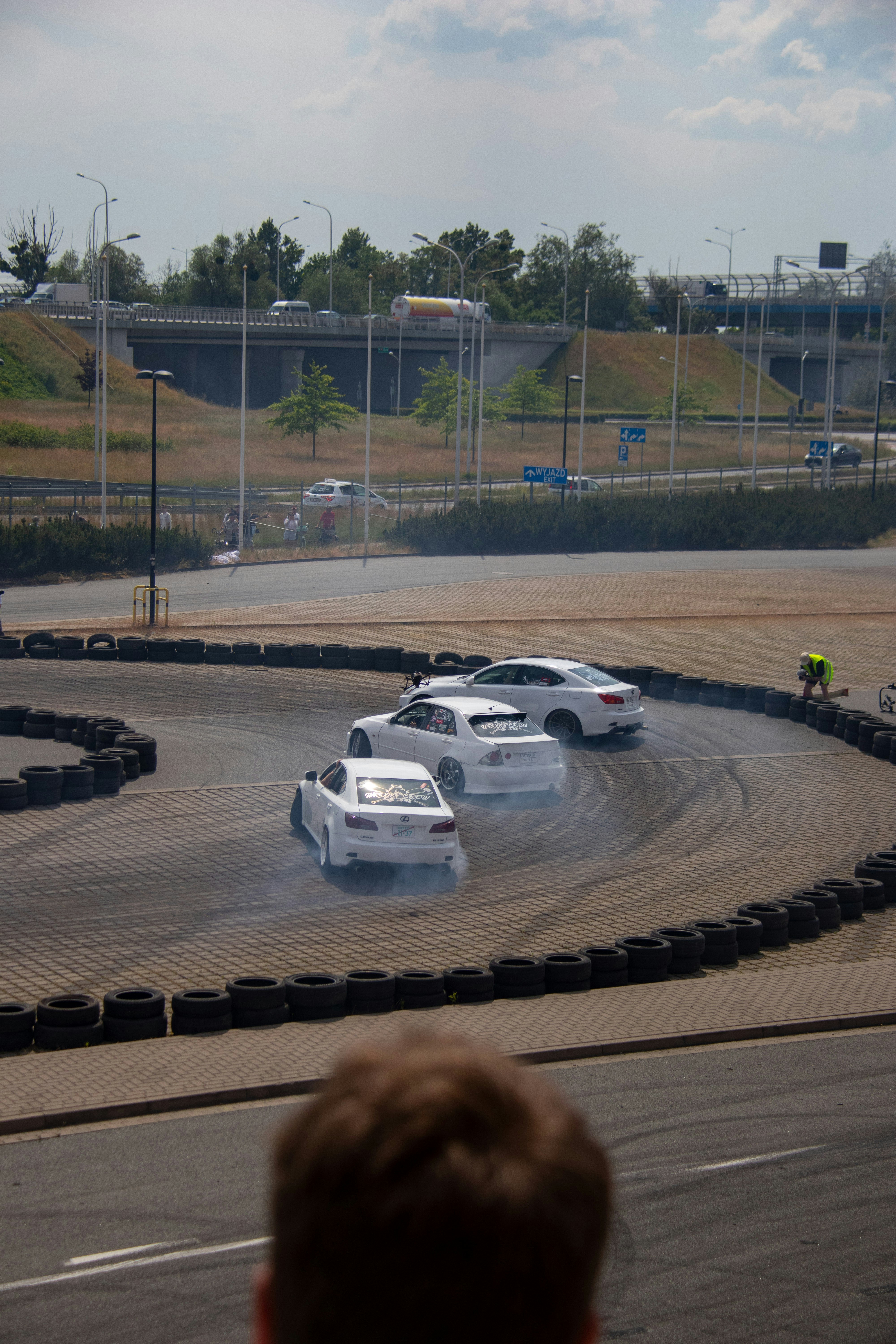 A couple of cars that are on a track photo – Free Road Image on Unsplash