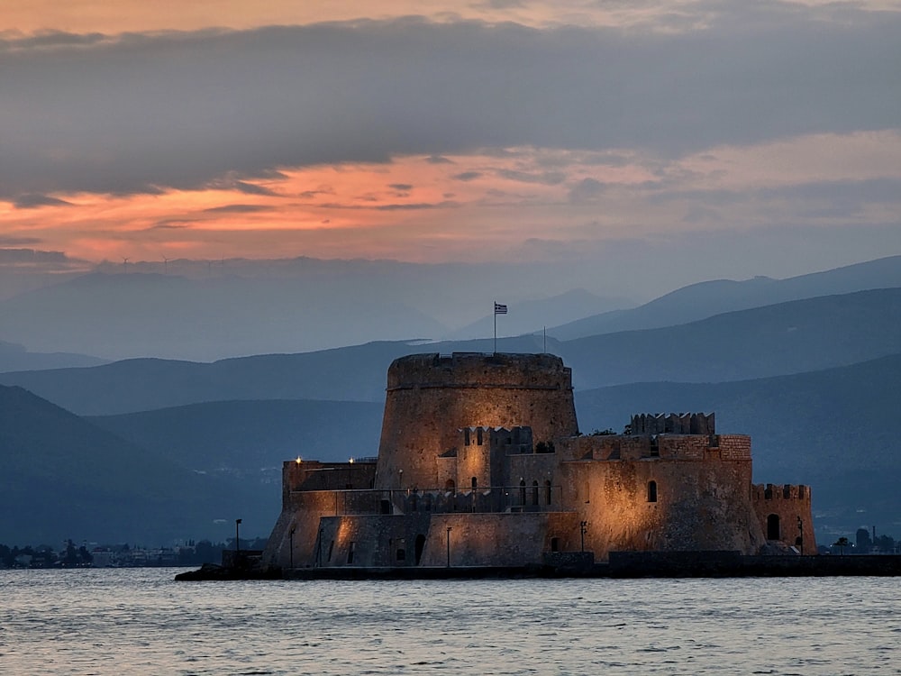 a castle sitting on top of a body of water