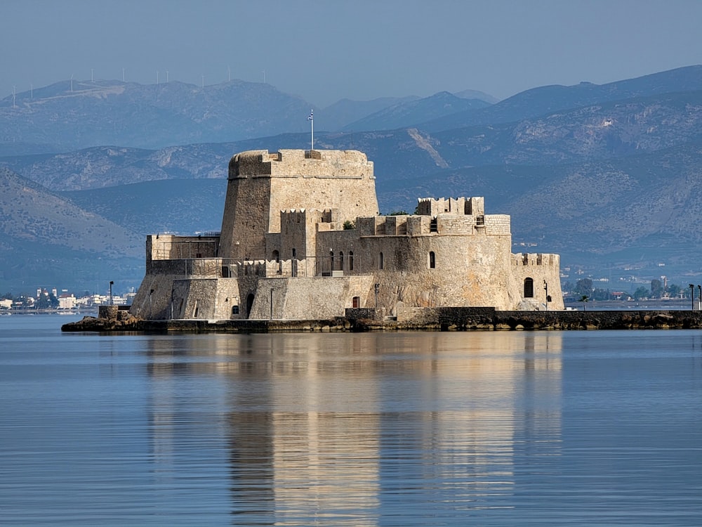 a castle sitting on top of a body of water