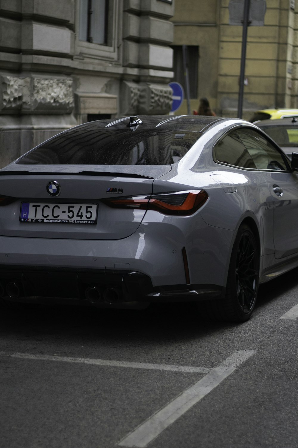 a silver car parked on the side of the road