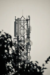 a very tall tower with lots of lights on top of it