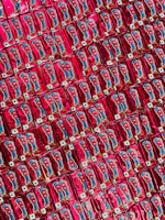 An artful arrangement of colorful crisp packets from UK brands on a rustic wooden table.